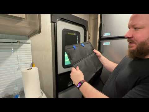 Hand On RV Door Velco Shade